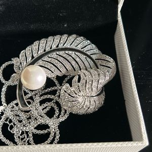 Beautiful silver broach with black and pearl detail.